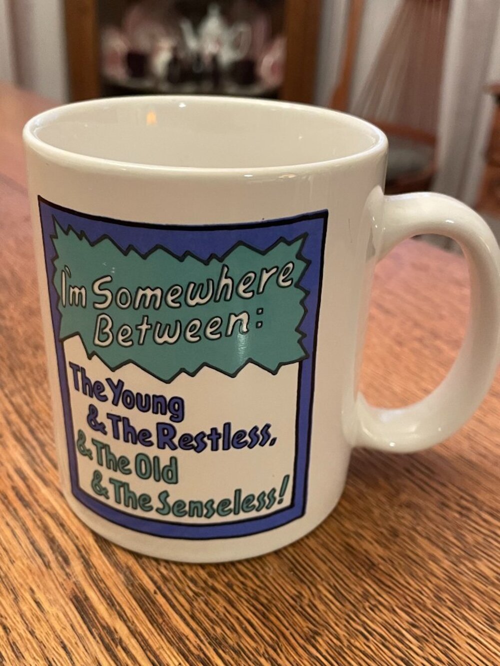 Vintage I'm Somewhere Between Humorous Age Themed Coffee Cup Mug 12 ounces